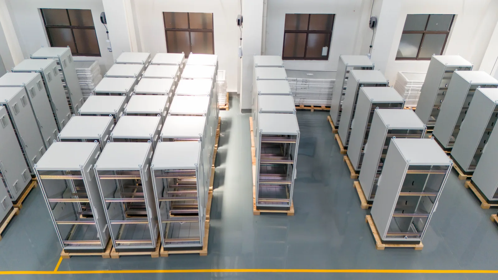 Control cabinet frames staged for assembly and wiring