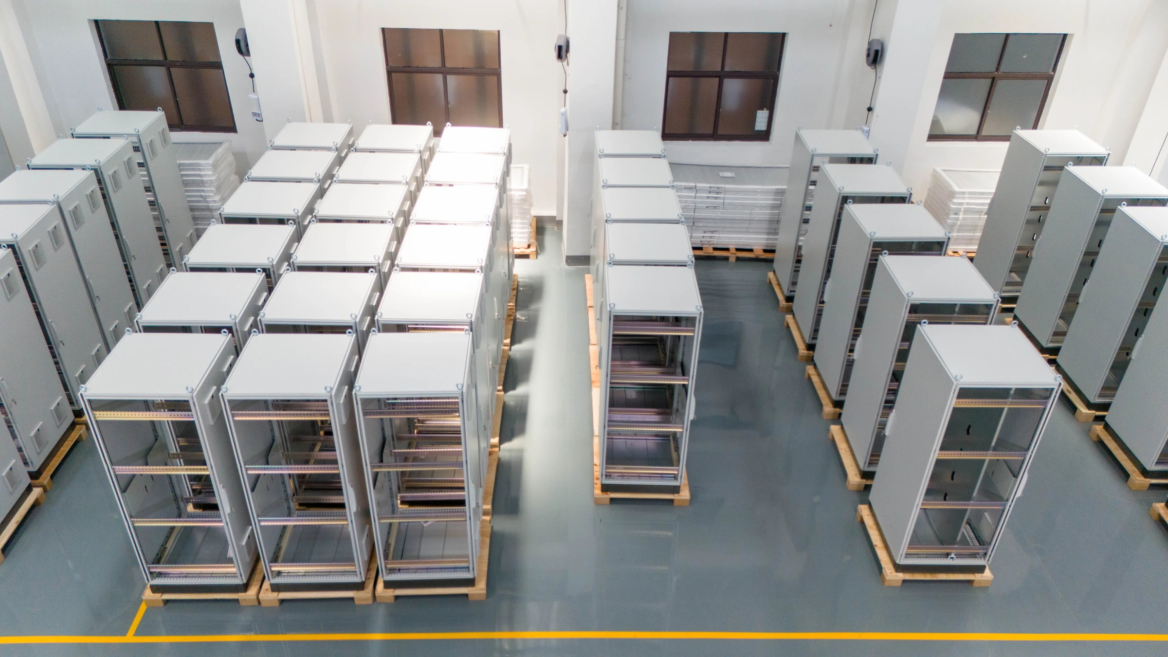 Control cabinet frames staged for assembly and wiring