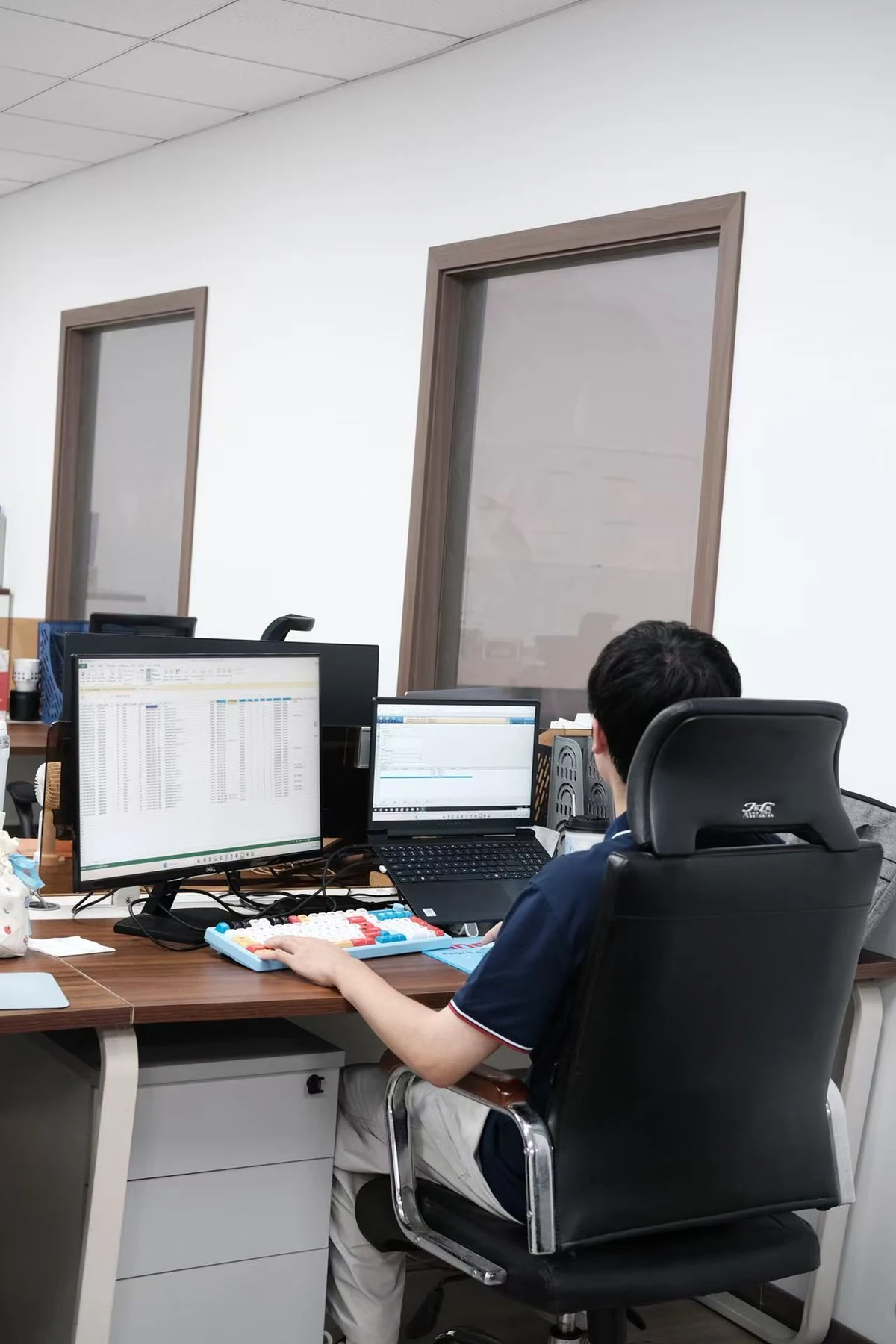 DCS configuration engineer at dual-screen workstation